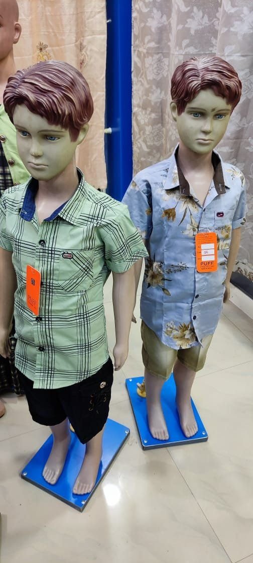 Boys casual check and floral shirts on kids mannequins